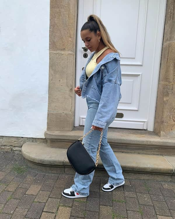 Tank Top with Denim Jacket on Denim Pants and Trainers + Handbag