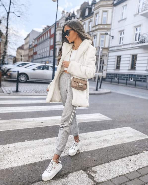 White Crop Top with Fur Jacket + Gray Sweatpants + White Shoes + Chic Bag + Sunglasses