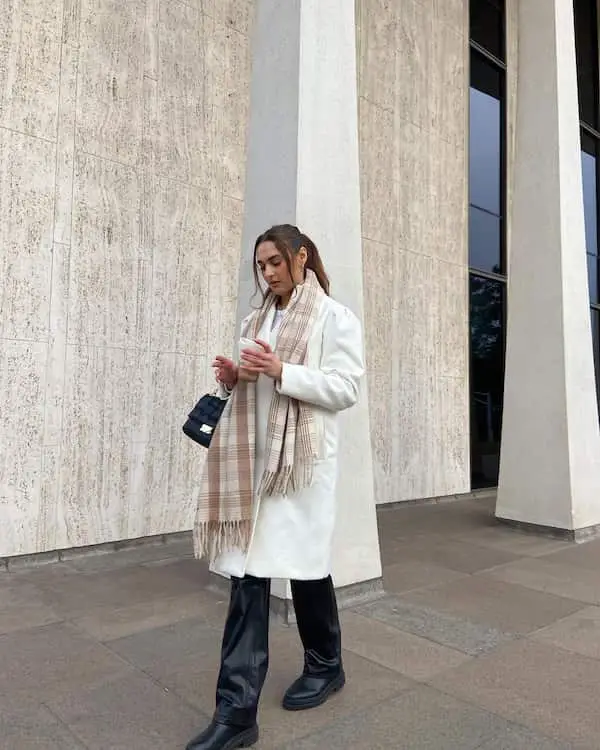 White Trench Coat + Leather Pants + Black Boots + Chunky Scarf + Handbag