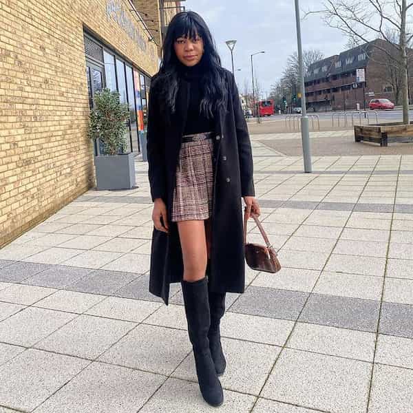 Black Top + Mini Pleated Skirt + Trench Coat + Knee-high Boot + Handbag