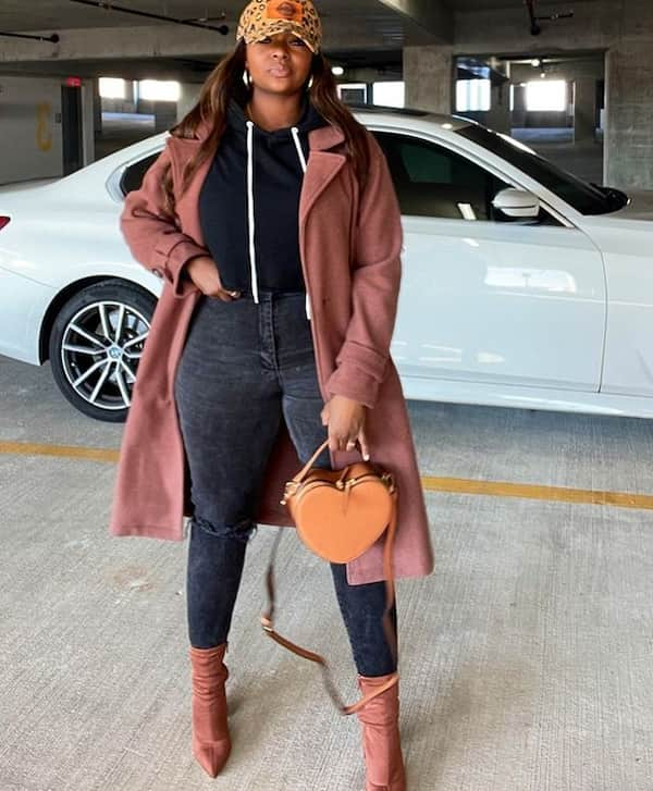 Black Top with White Strands + Pea Coat + Distressed Black Jeans + Boots + Face Cap + Handbag