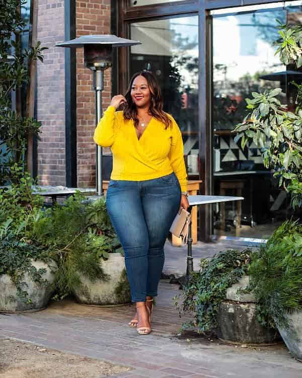 Yellow Upper Wrapped Shirt + Blue Jeans + Heels + Clutch