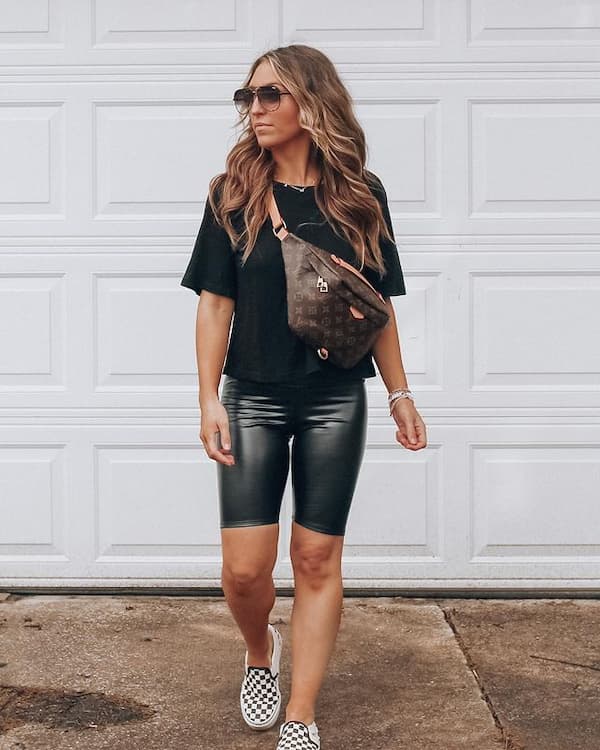 Black T-Shirt with Black Leather Tight Shorts + Sneakers + Cross Shoulder Bag + Sunglasses