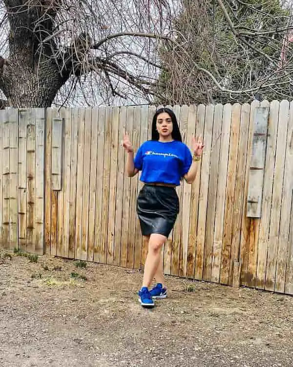 Blue Graphic T-Shirt with Black Leather Skirt + Sneakers