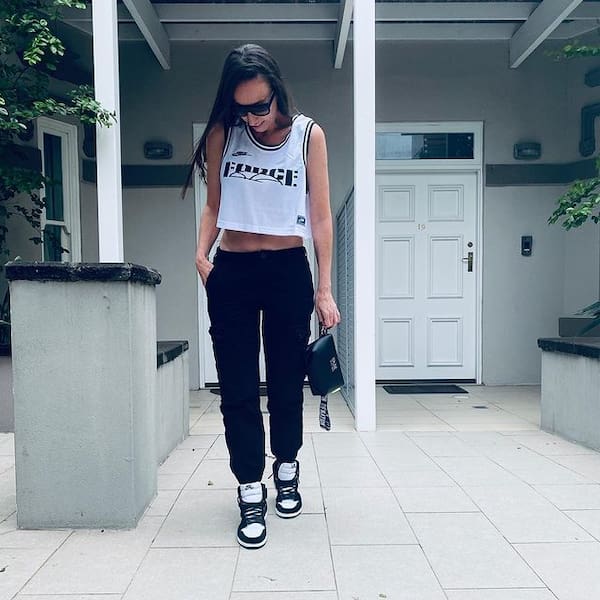 Graphic White Tank Top with Black Pants + Midi Handbag + Sunglasses