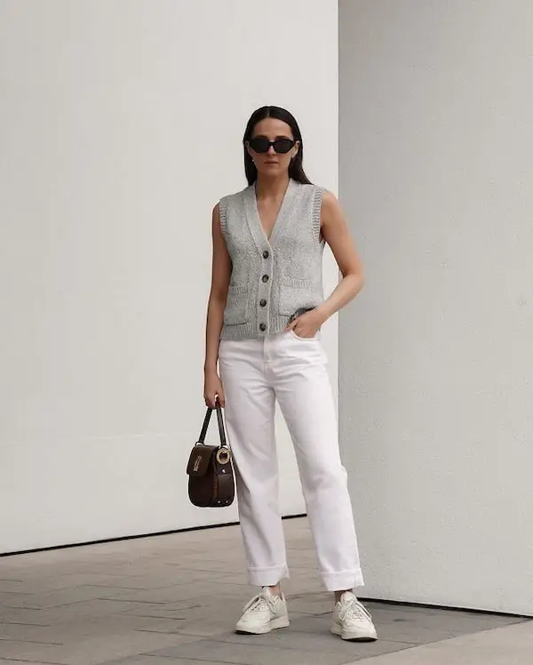 Neutral Colored Knit Vest with White Jeans + Sneakers + Midi Handbag + Sunglasses