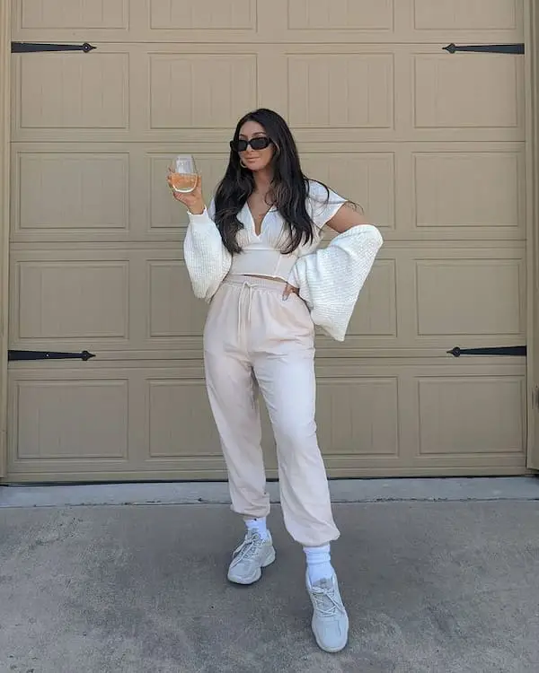 White V-neck Top with Joggers + Sneakers + Sunglasses