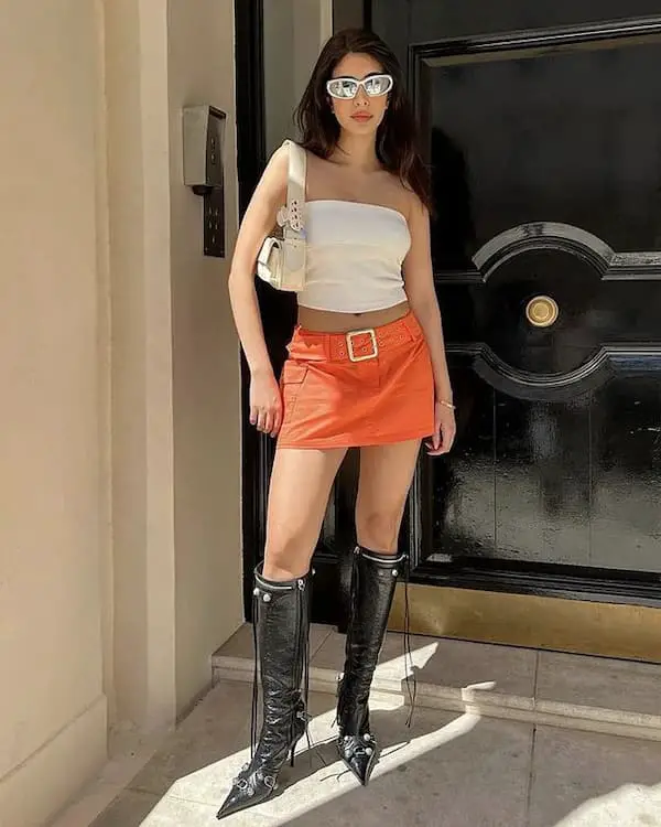 Black Rain Boots and Orange Mini Skirt with White Sleeveless Crop Top + Handbag + Sunglasses