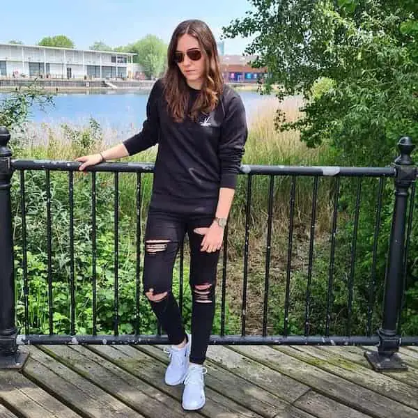 Black Shirt with Black Ripped Jeans + Sneakers + Sunglasses
