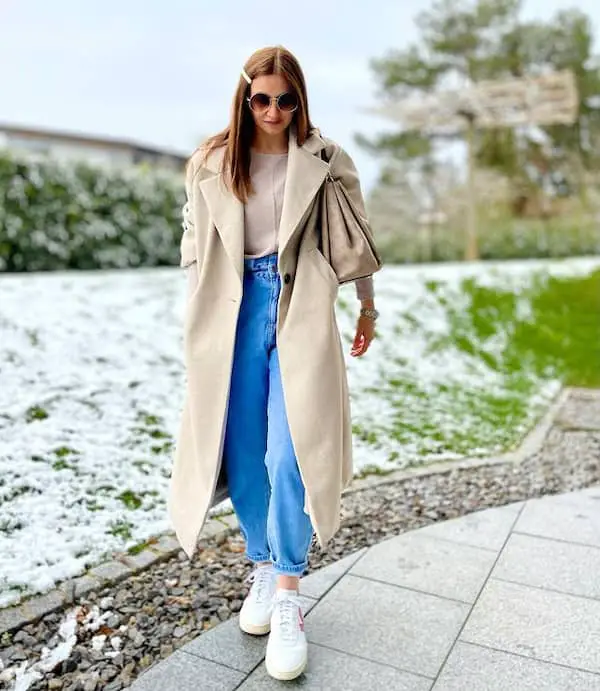 Blue Carrot Jeans and White Sneakers + Sand Colored Shirt + Tan Trench Coat + Handbag + Sunglasses