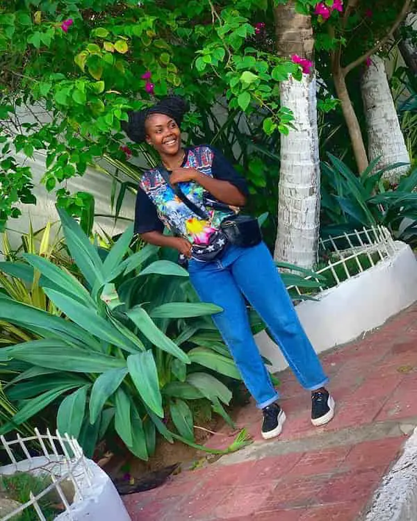 Blue Graphic Shirt with Blue Jeans + Sneakers + cross Shoulder Bag