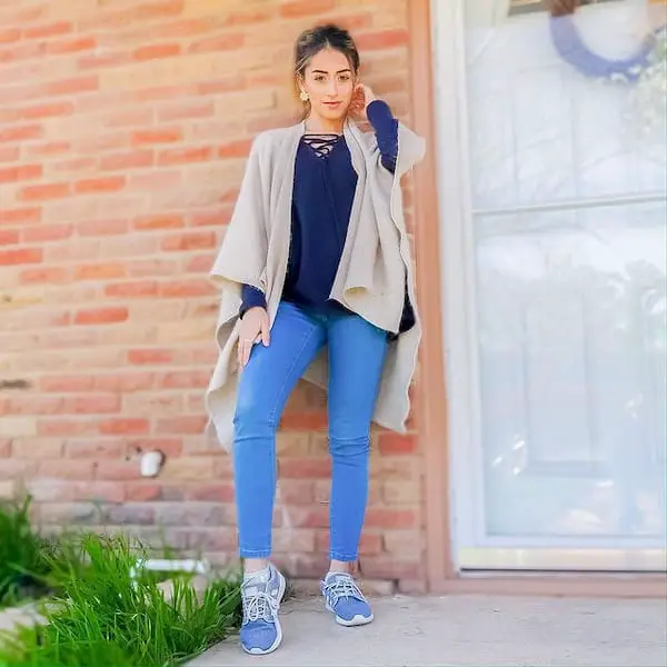 Blue Jeans and Blue Sneakers with Navy Blue Blouse with Tan Wrap Jacket