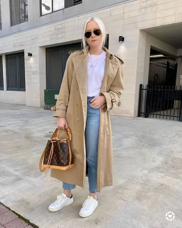 Blue Jeans and White Sneakers with White Top + Brown Trench Coat + Handbag + Sunglasses