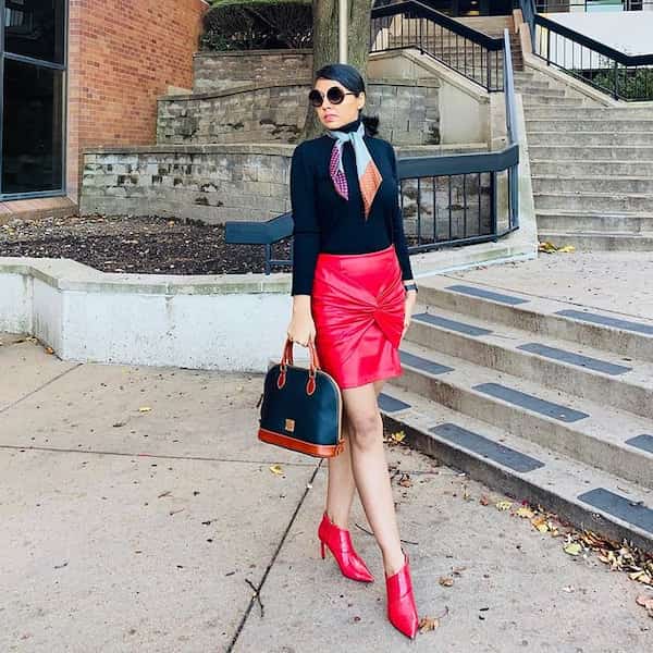Red Faux Leather Skirt with Black Long Sleeve + Red Heeled Boots + Double Colored Handbag + Sunglasses