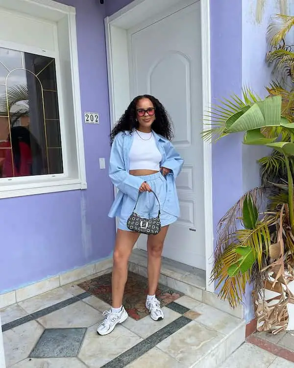 White Crop Top with Denim Jacket + Denim Shorts + Sneakers + Handbag + Sunglasses