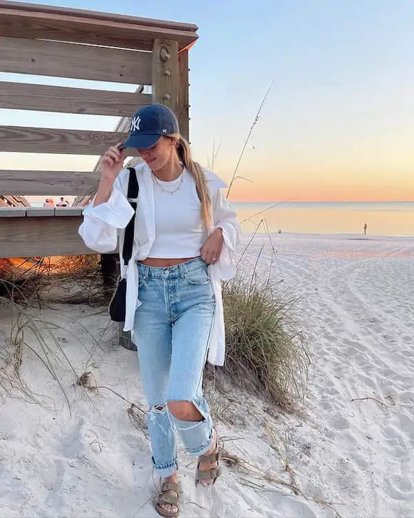 White Top with White Jacket + Ripped Jeans + Sandals + Face Cap + Handbag