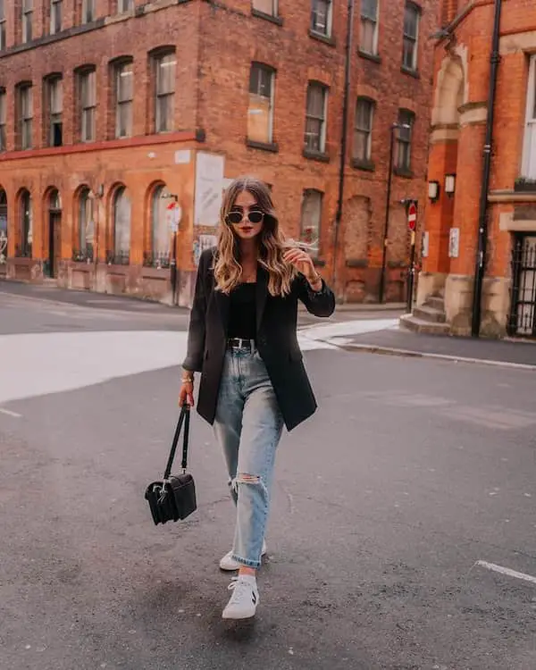 Blue Ripped Jeans and Black Blazer with Black Shirt + Sneakers + Handbag + Sunglasses