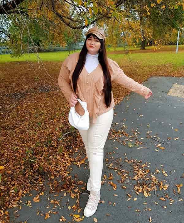 White Leggings with White Turtle Neck Shirt + Brown Ruffle Knit Cardigan + Sneakers + Clutch Purse + Face Cap