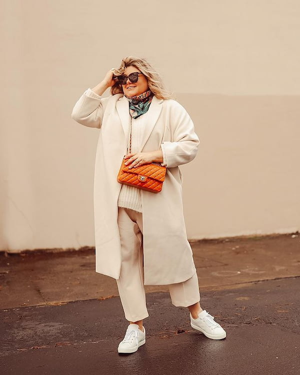 White Top with Sand Colored Pants + White Trench Coat + Sneakers + Handbag + Sunglasses