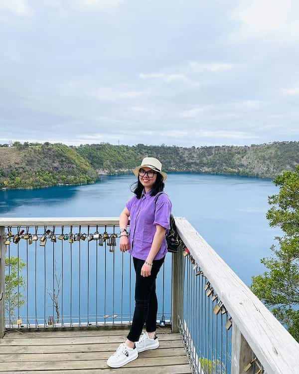 Purple Shirt with Black Jeans and White Sneakers + Hat